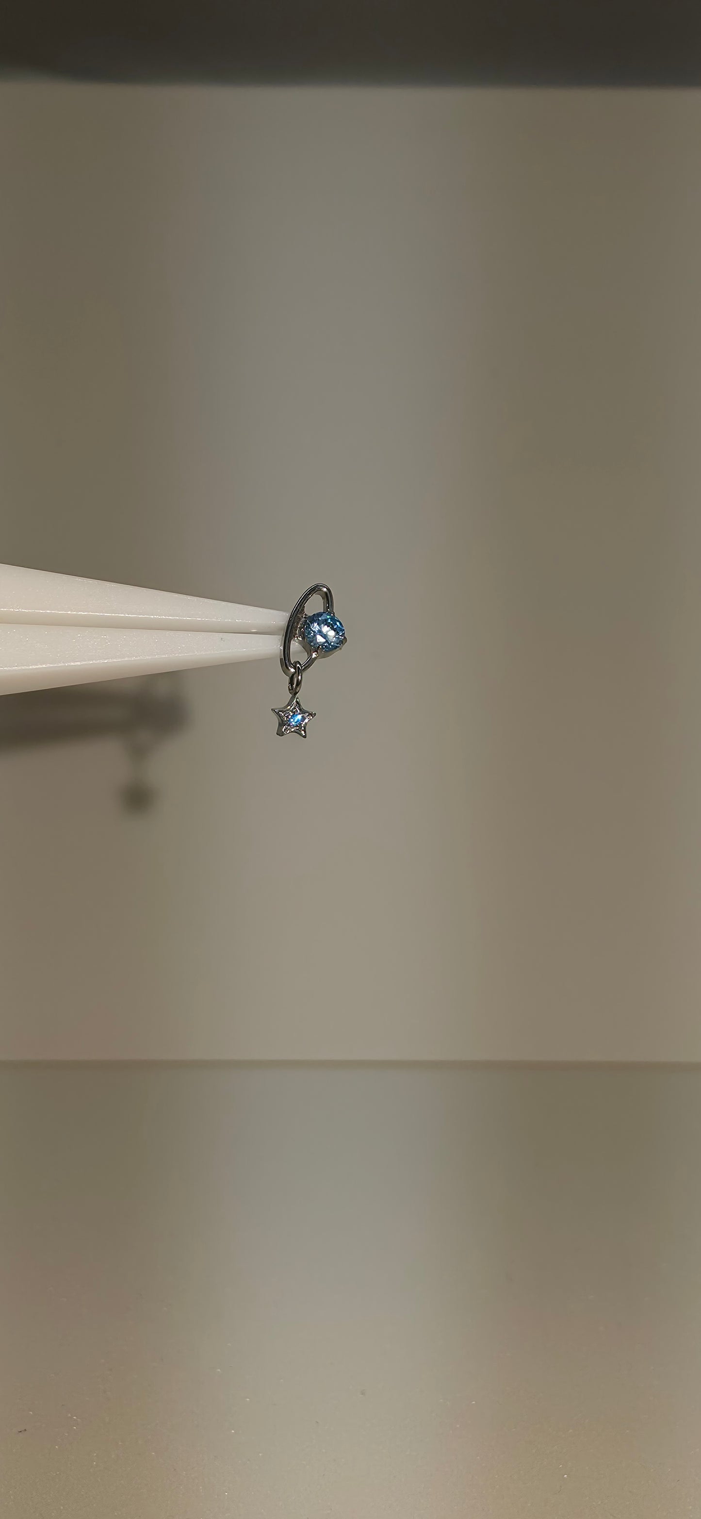 Piercing Titanio planeta