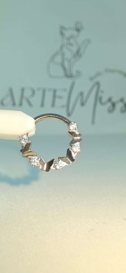 Clicker de Titanio con figuras de mariposa e incrustaciones de zirconia