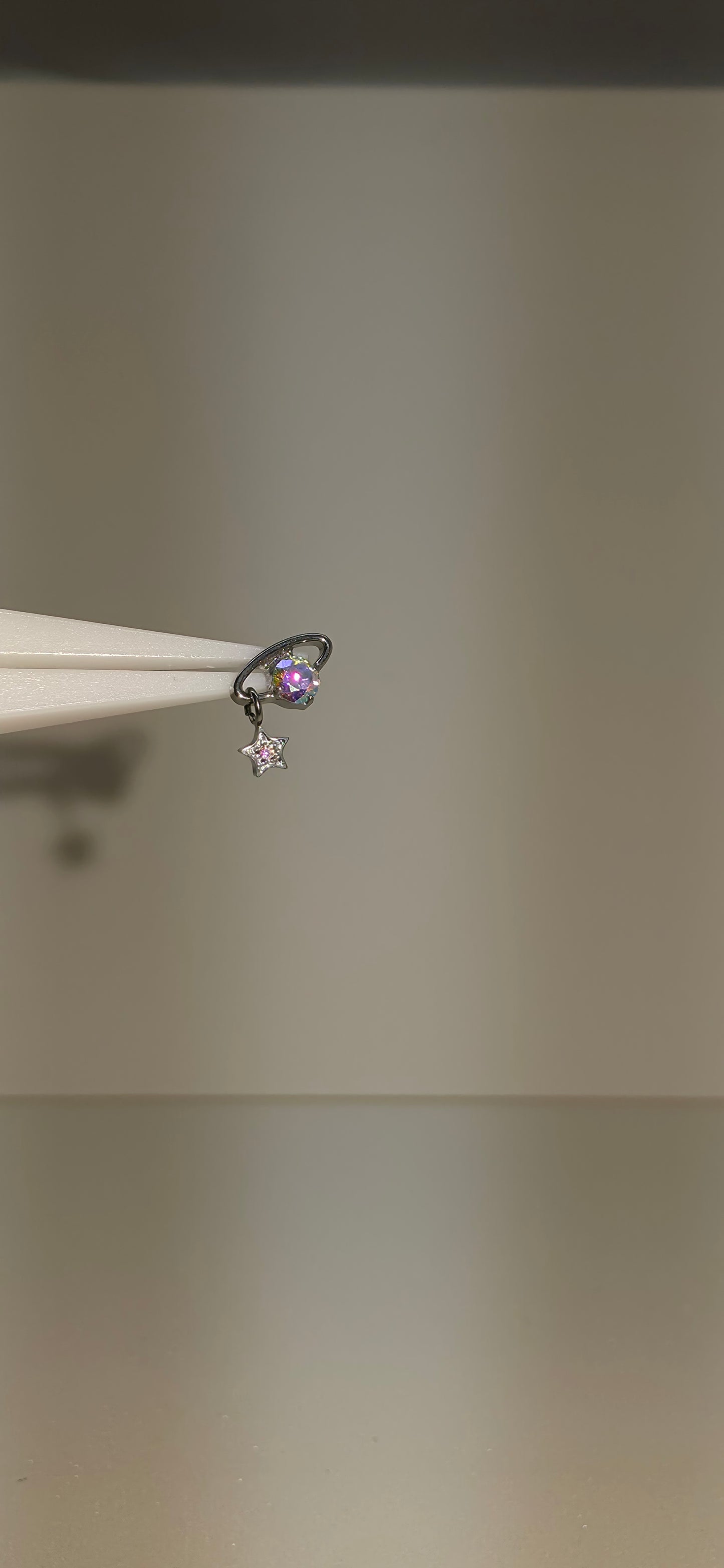 Piercing Titanio planeta