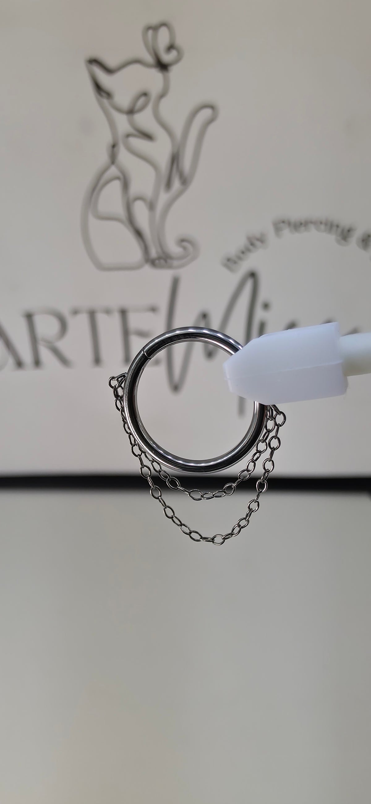 Clicker, argolla con cadena