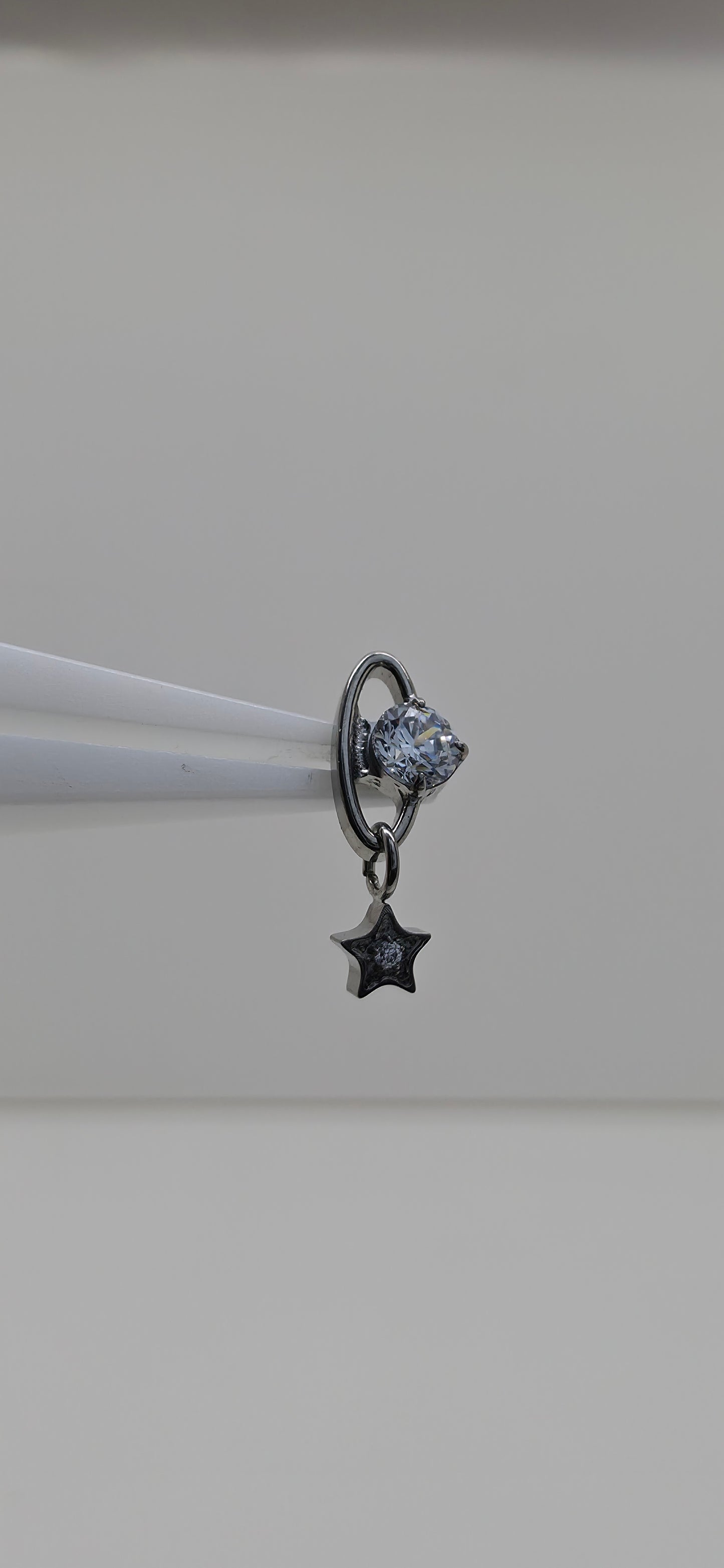 Piercing Titanio planeta