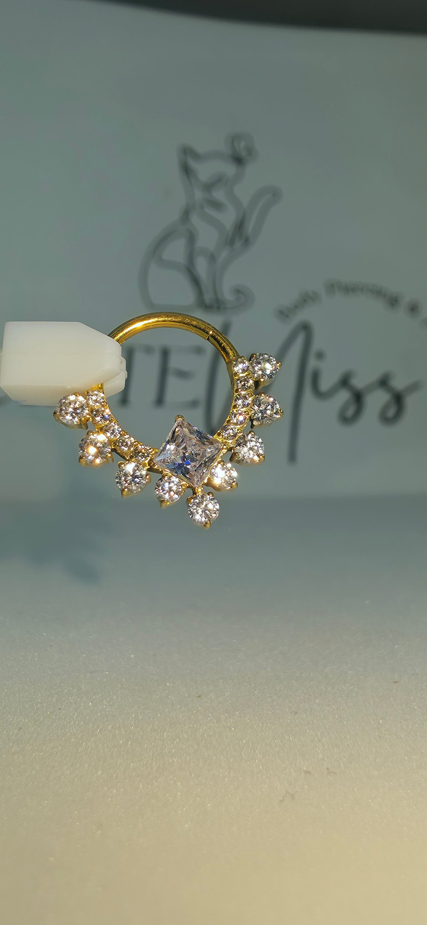 Clicker de Titanio con incrustaciones de zirconia varios colores