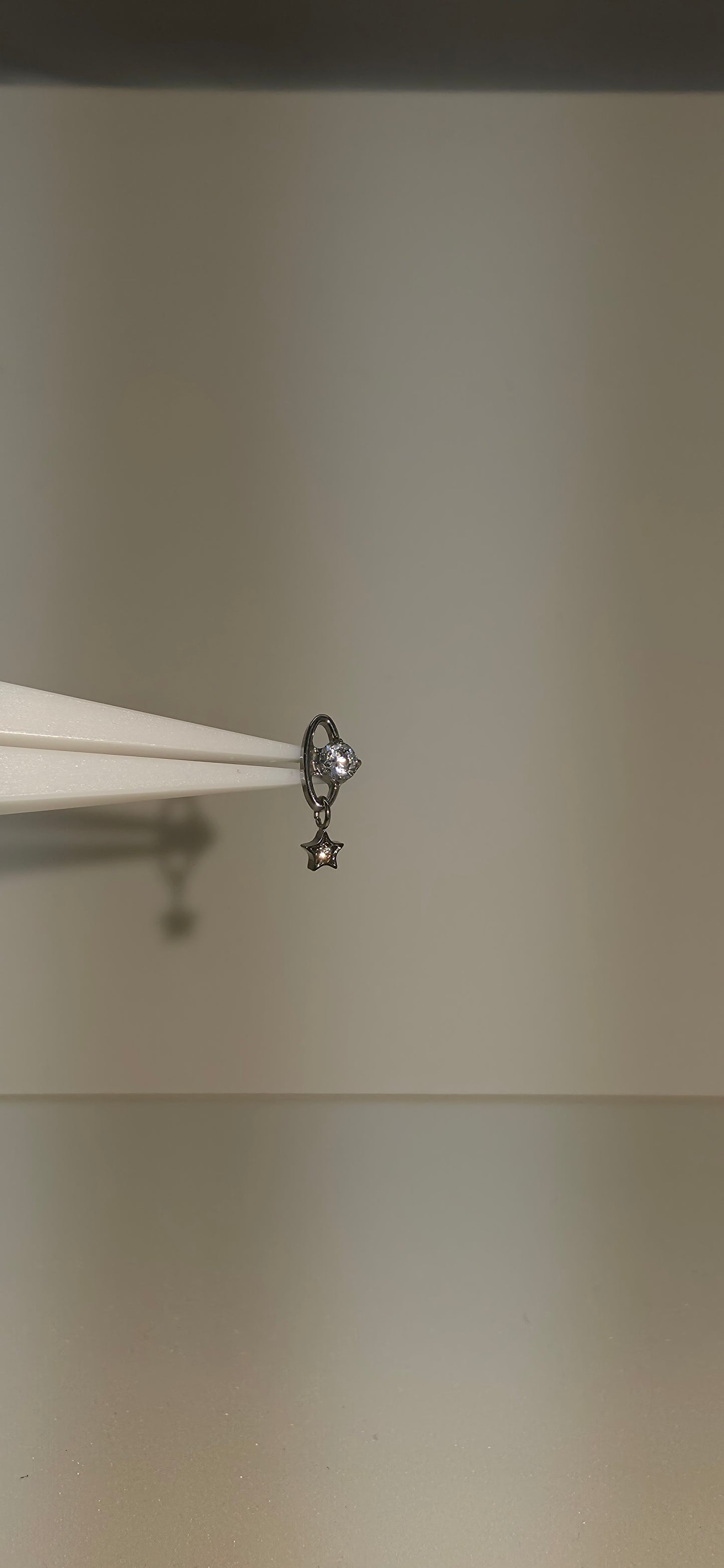 Piercing Titanio planeta