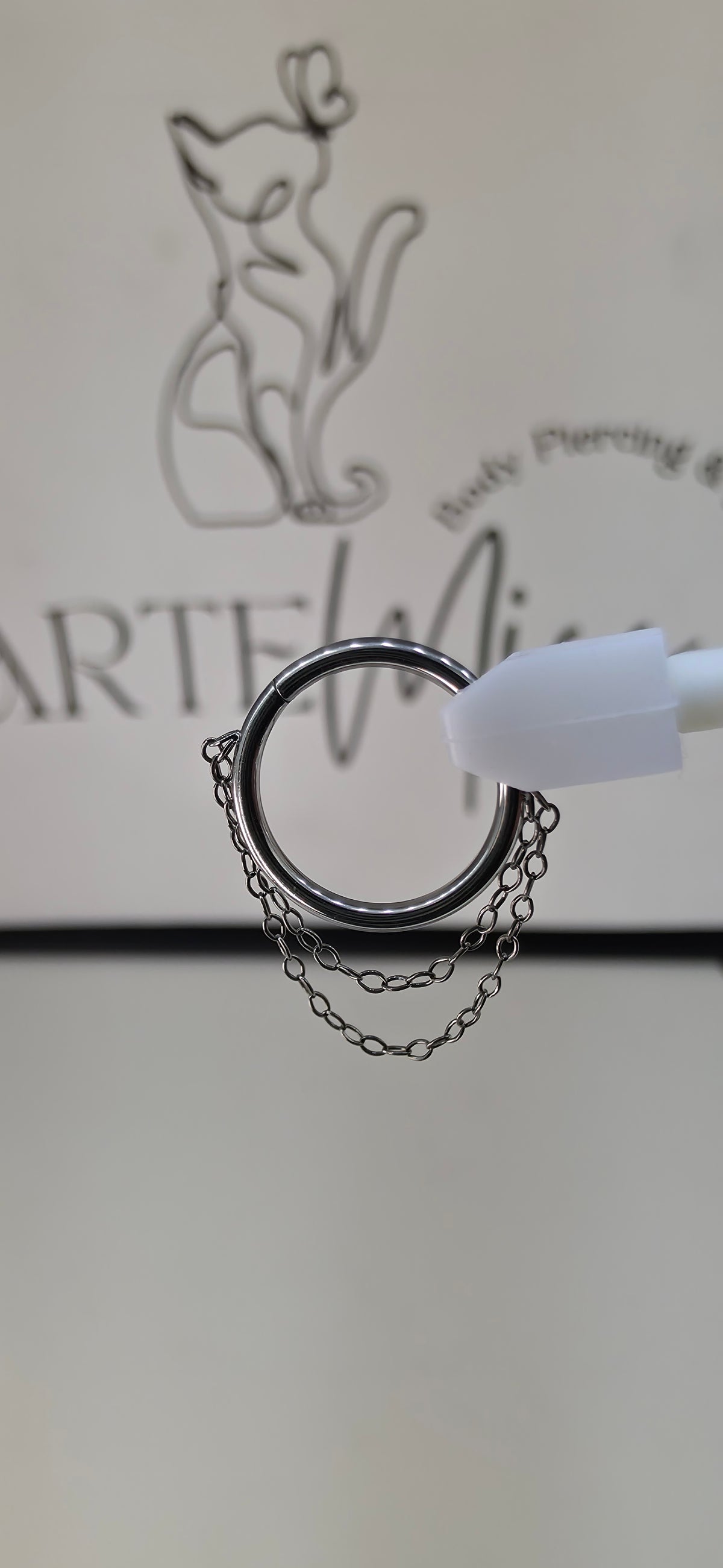 Clicker, argolla con cadena