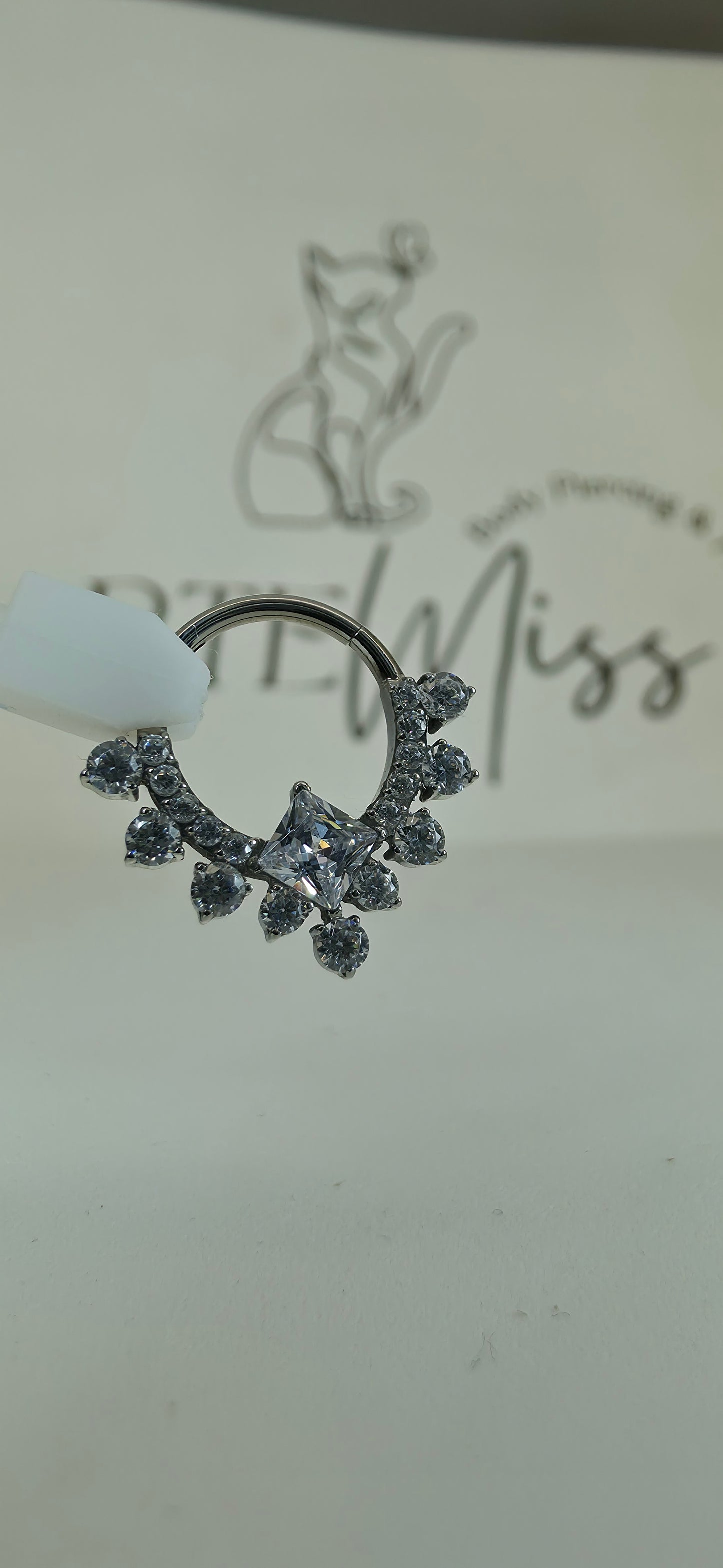 Clicker de Titanio con incrustaciones de zirconia varios colores